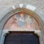 --Madonna col Bambino tra San fiorenzo e San Giovanni Battista nella lunetta del portale