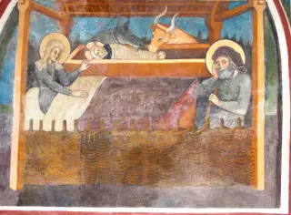 Testata chiesa, absidiola Sud, Natività, particolare - Chiesa di San Pietro o San Peyre a Stroppo